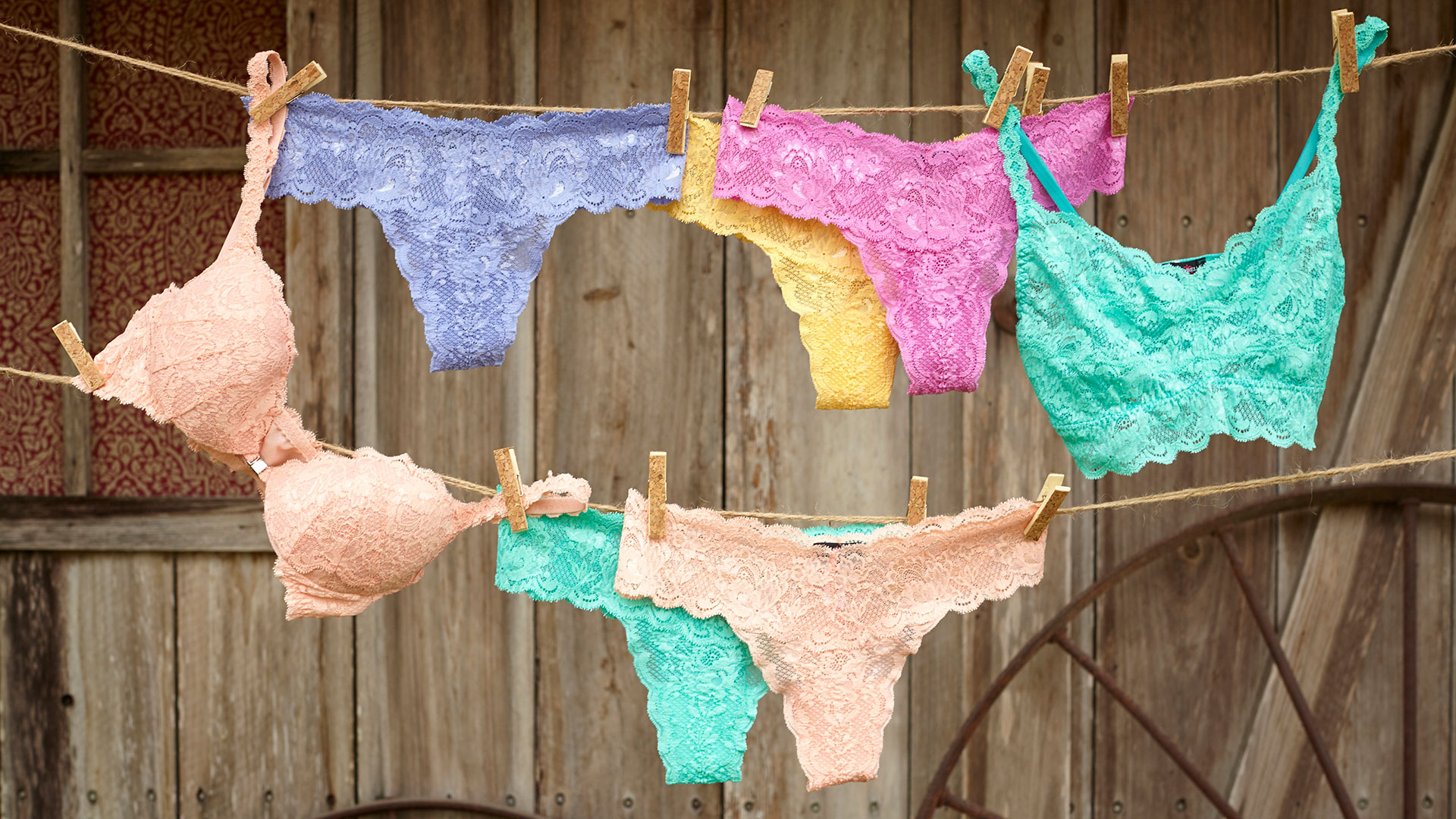 Lingerie hanging on clothes lines photographed by soft goods still life photographer Kate Benson.