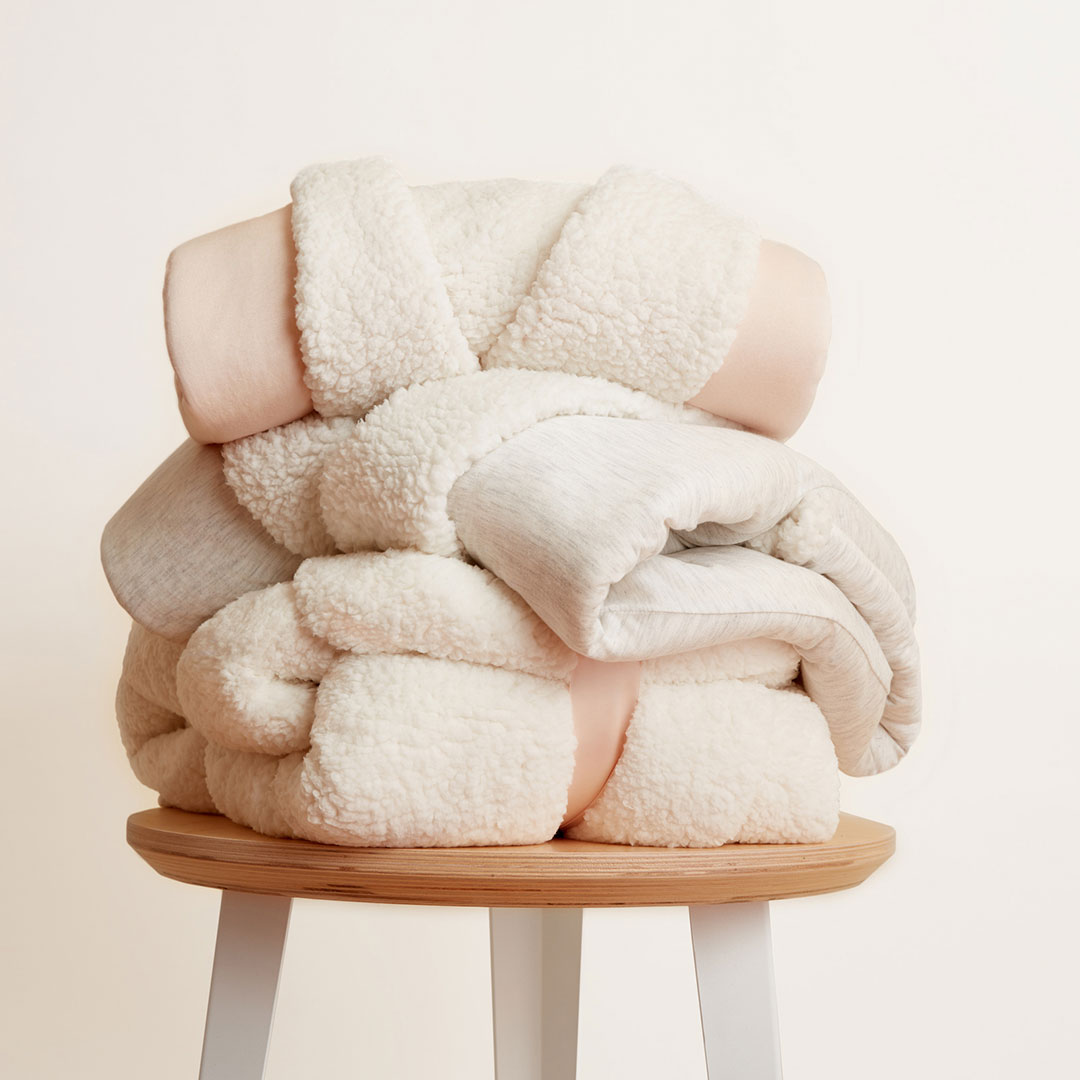 Stacked soft goods robes styled and photographed by accessories product photographer Kate Benson.