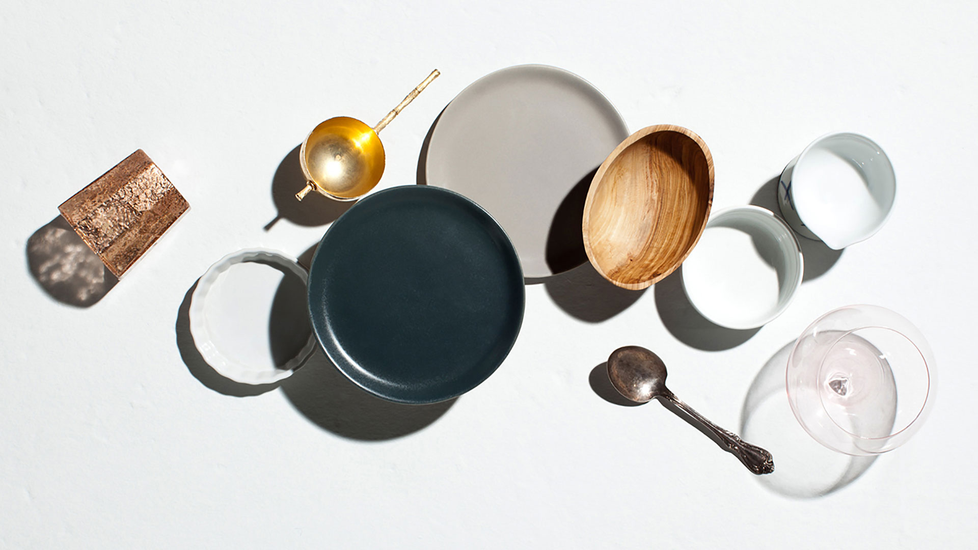 Styled overhead of plates and dishware photographed by professional food and beverage photographer Kate Benson.