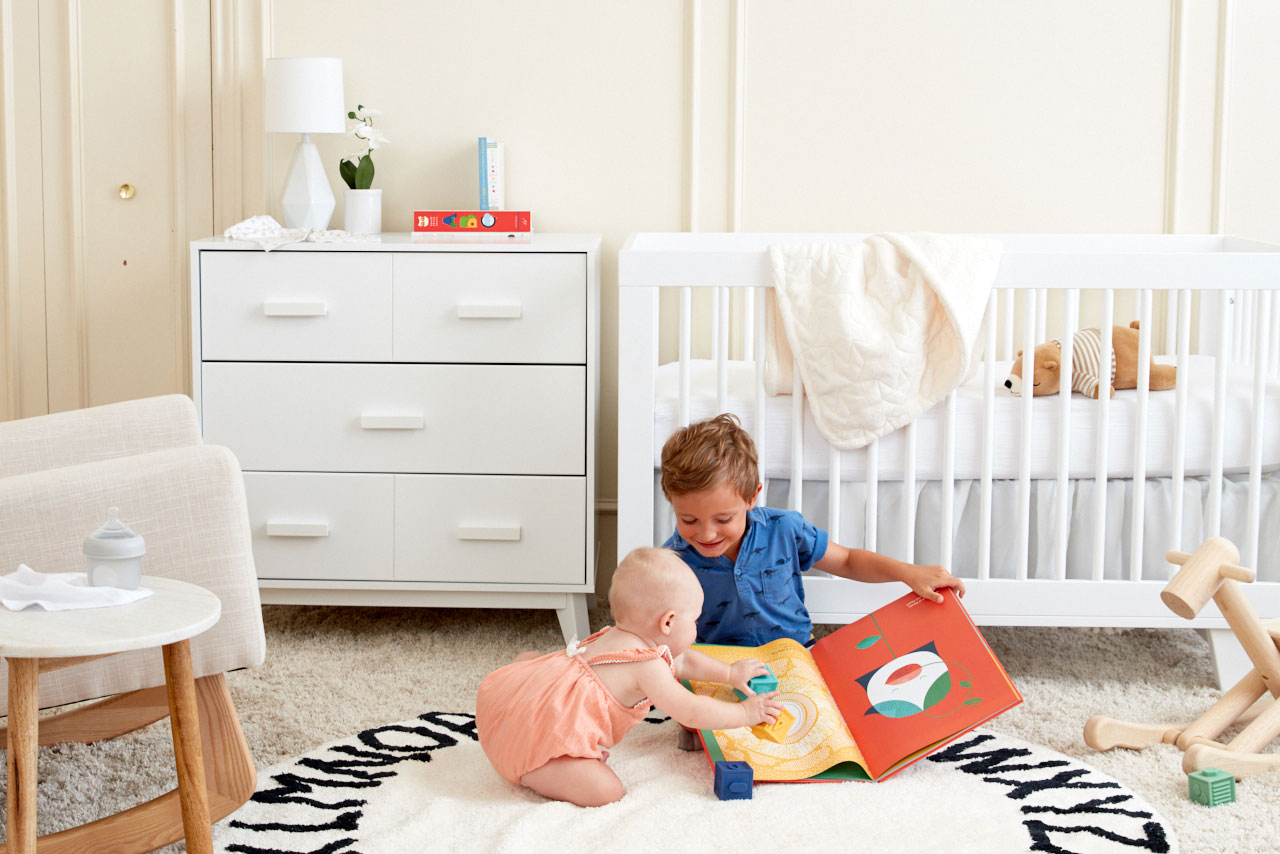 Lifestyle image of children playing in nursery styled and photographed by professional product photographer Kate Benson.