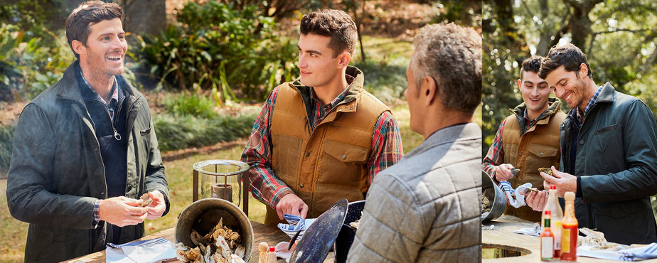 Male fashion models shucking oysters at oyster roast photographed by fashion lifestyle photographer Kate Benson.